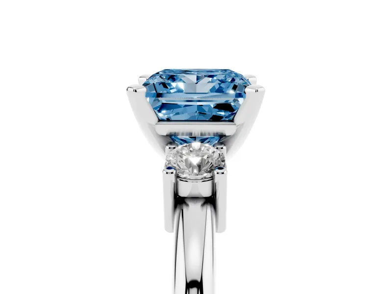 Fancy Blue Three-Stone Princess Cut Diamond Ring Set in Platinum with Prong Setting and Plain Band