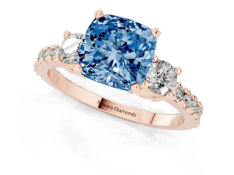 Fancy Blue Three-Stone Cushion Cut Diamond Pavé Band Ring Set in Rose gold with Prong Setting
