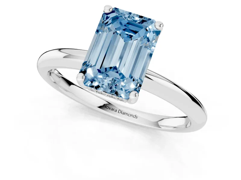Fancy Blue Emerald Cut Diamond Solitaire Engagement Ring Set in White gold with Prong Setting and Polished Band