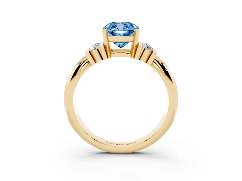 Fancy Blue Three-Stone Cushion Cut Diamond Channel Set Ring Set in Yellow gold with Bar Prongs