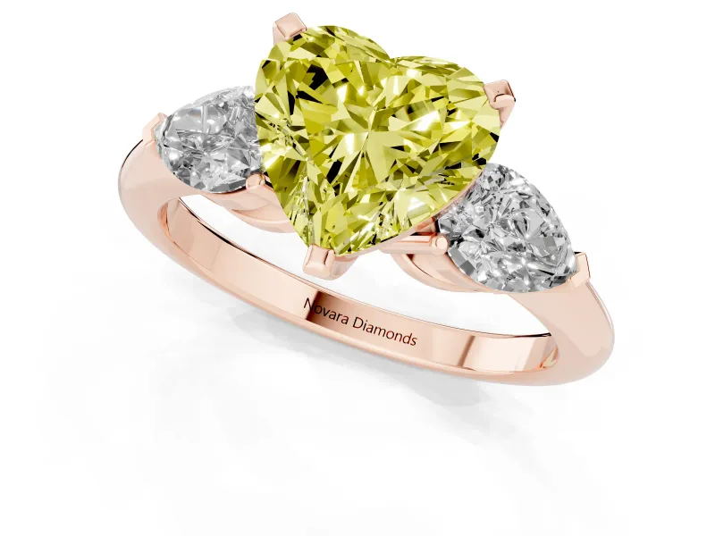 Fancy Yellow Three-Stone Heart Cut Diamond Ring Set in Rose gold with Pear Side Stones and Prong Setting
