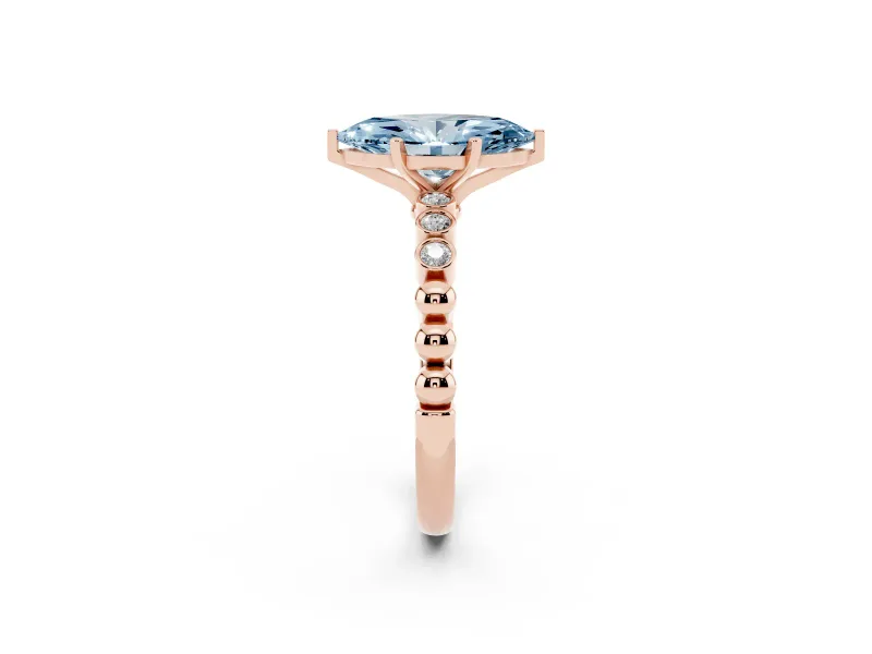 Fancy Blue Marquise Cut Diamond Solitaire Engagement Ring Set in Rose gold with Bezel Accents on Beaded Band