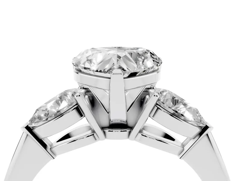 Three-Stone Heart Cut Diamond Ring Set in Platinum with Pear Side Stones and Prong Setting