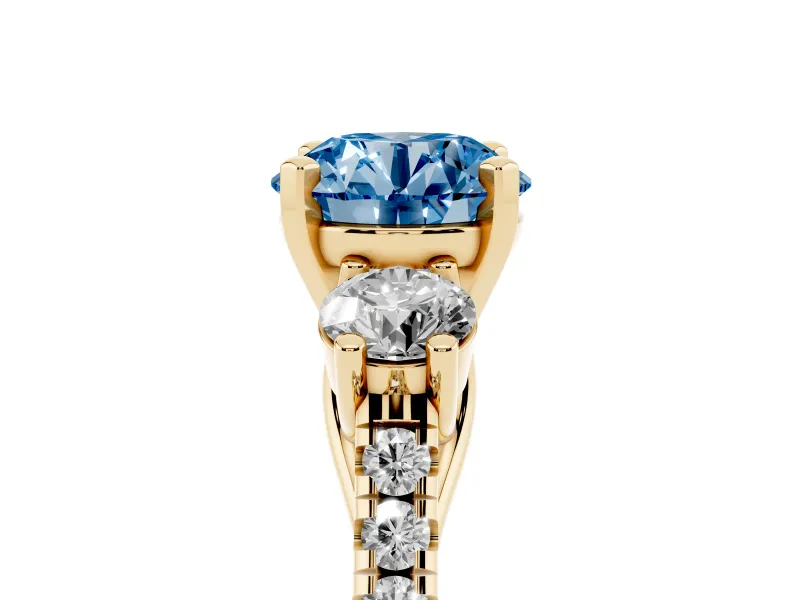 Fancy Blue Three-Stone Round Cut Diamond Pavé Band Ring Set in Yellow gold with Prong-Set Trio