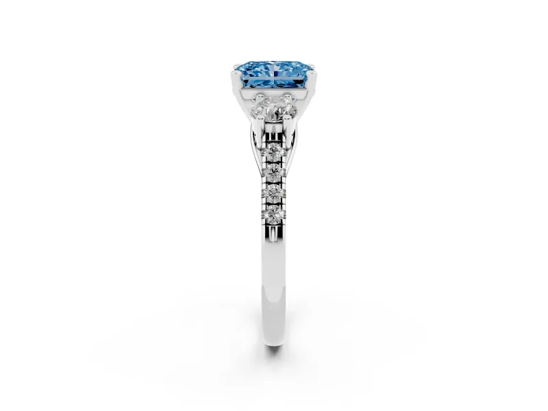 Fancy Blue Three-Stone Radiant Cut Diamond Pavé Band Ring Set in White gold with Prong-Set Trio