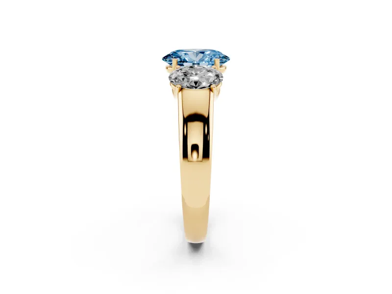 Fancy Blue Three-Stone Oval Cut Diamond Ring Set in Yellow gold with Matching Prong Settings and Plain Band