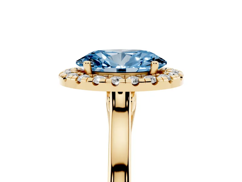 Fancy Blue Oval Cut Halo Round Diamond Solitaire Ring Set in Yellow gold with Pavé Band and Prong Setting