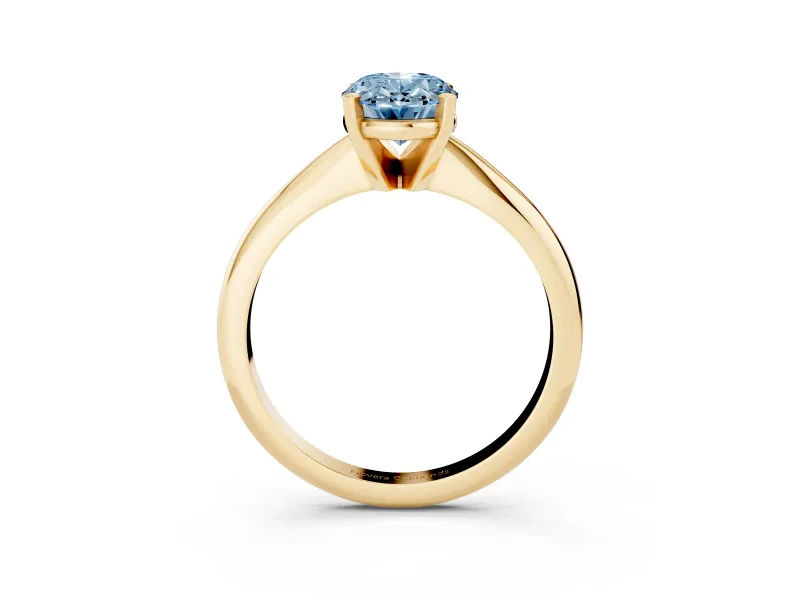 Fancy Blue Oval Cut Diamond Solitaire Ring Set in Yellow gold with Prong Setting on a Plain Round Band
