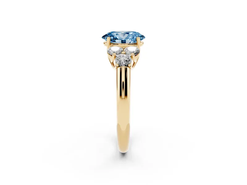 Oval Side Stone Engagement Ring Setting for a Fancy Blue Lab-Grown Diamond | Yellow Gold