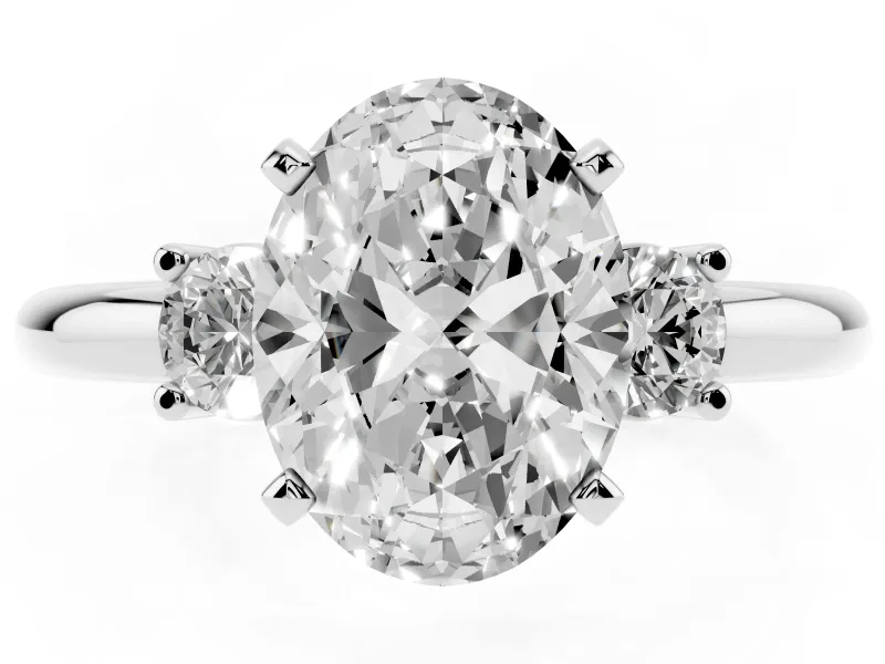 Three-Stone Oval Cut Diamond Ring Set in White gold with Prong Setting and Plain Band