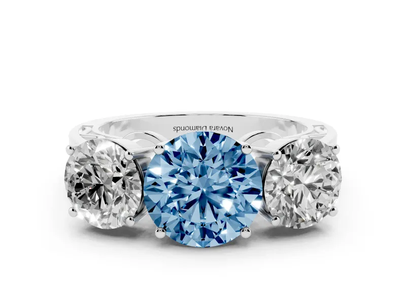Fancy Blue Round Cut Diamond Three-Stone Ring Set in White gold with Textured Band