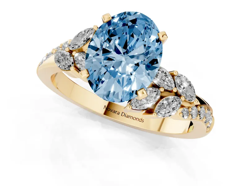 Fancy Blue Oval Cut Diamond Solitaire Ring Set in Yellow gold with Marquise Twist Band and Prong Setting