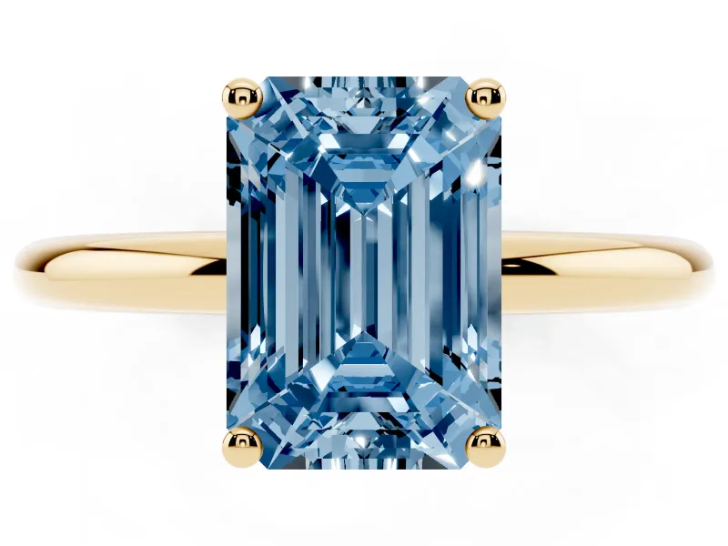 Fancy Blue Emerald Cut Diamond Solitaire Engagement Ring Set in Yellow gold with Prong Setting and Polished Band