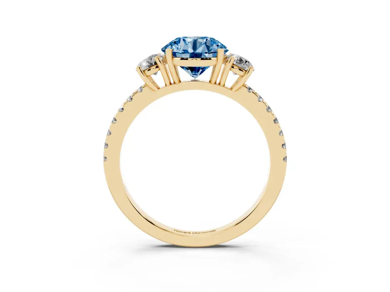 Fancy Blue Round Cut Diamond Three-Stone Ring Set in Yellow gold with Pavé Band and Graduated Sides