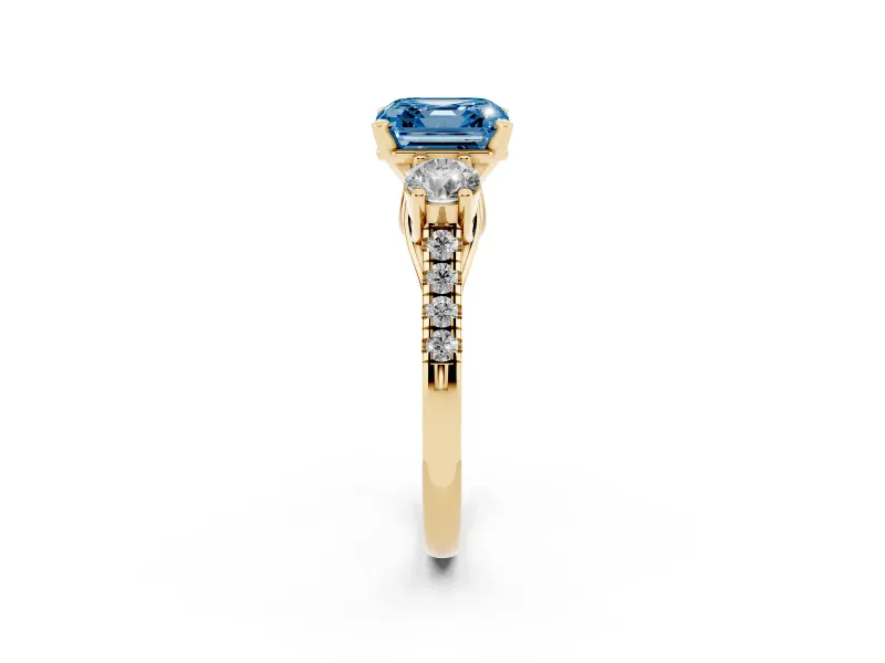 Fancy Blue Three-Stone Asscher Cut Diamond Pavé Band Ring Set in Yellow gold with Prong-Set Trio