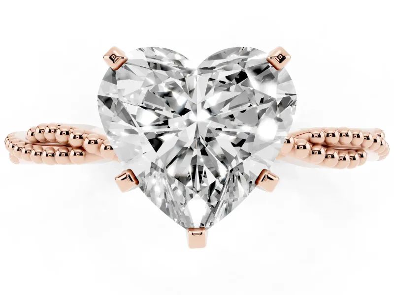 Heart Cut Diamond Solitaire Ring Set in Rose gold with Twisted Band and Bead Prong Setting