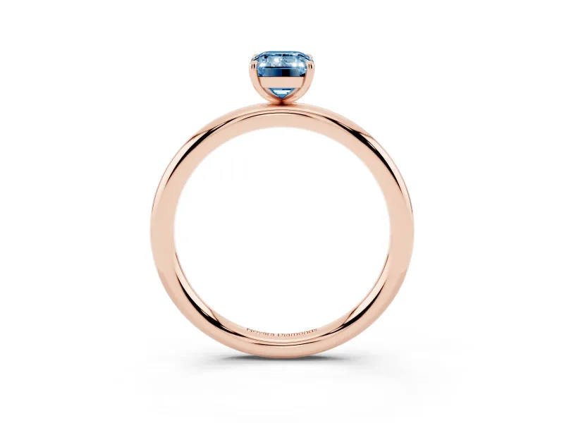 Fancy Blue Emerald Cut Diamond Solitaire Ring Set in Rose gold with Prong Setting on a Polished Plain Band