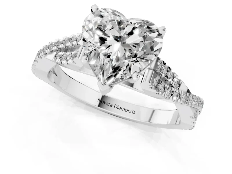 Heart Cut Diamond Solitaire Engagement Ring Set in White gold with Twisted Pavé Band and Prong Setting