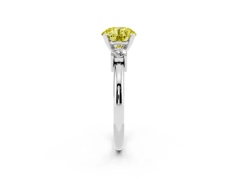 Fancy Yellow Three-Stone Round Cut Diamond Ring Set in Platinum with Prong Setting and Plain Band