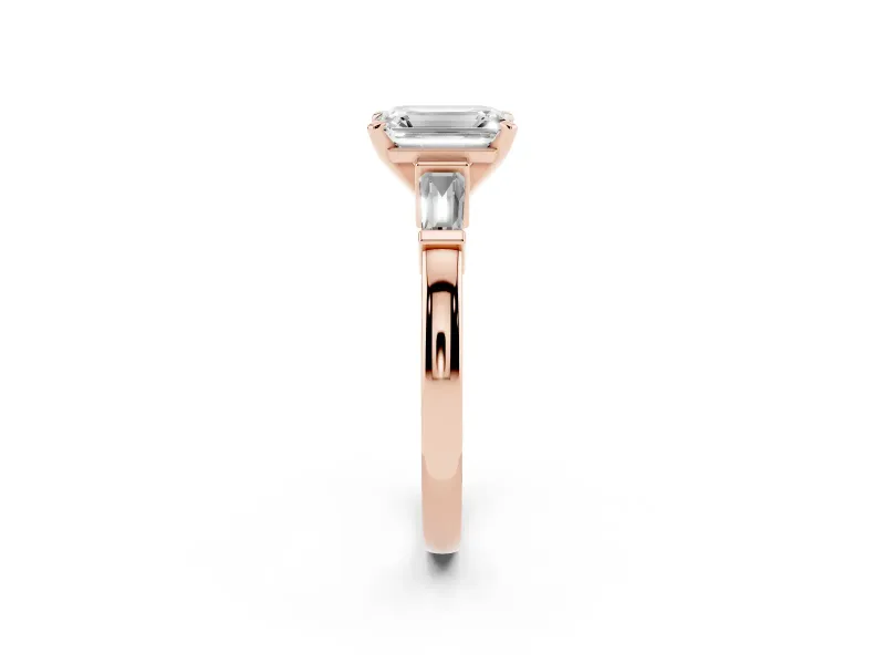 Emerald Cut Diamond Solitaire Ring Set in Rose gold with Tapered Baguette Accents and Prong Setting