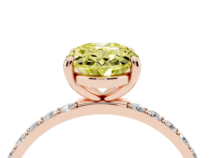 Fancy Yellow Oval Cut Diamond Solitaire Ring Set in Rose gold with Round Pavé Band and Prong Setting