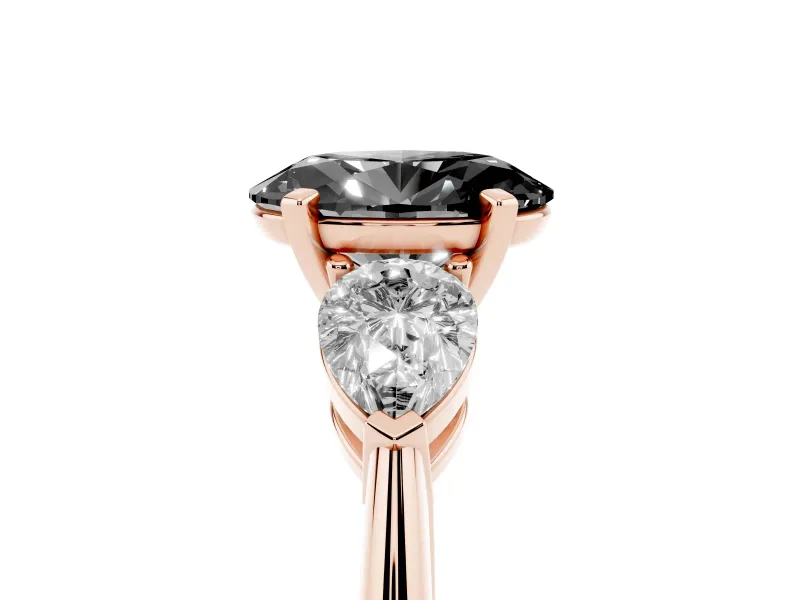 Fancy Black Three-Stone Oval Cut Diamond Ring Set in Rose gold with Pear Side Stones and Prong Setting
