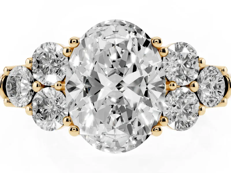 Oval Cut Diamond Cluster Ring Set in Yellow gold with Round Accent Stones and Prong Setting on a Plain Band