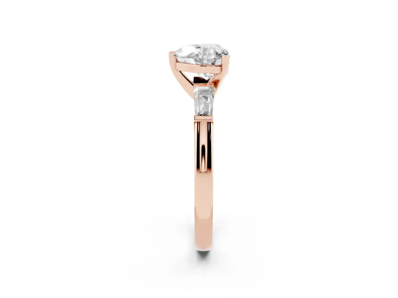 Heart Cut Diamond Solitaire Ring Set in Rose gold with Tapered Baguette Side Stones and Prong Setting