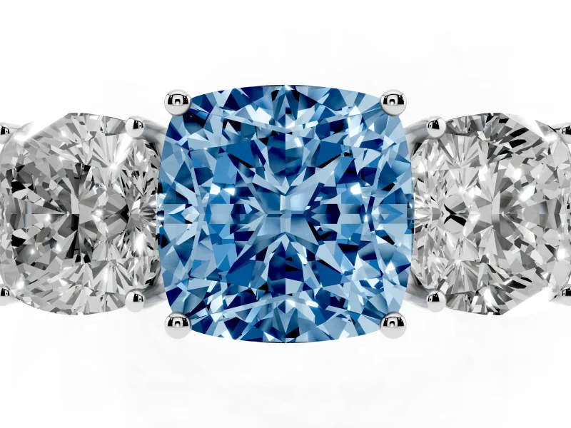 Fancy Blue Cushion Cut Diamond Three-Stone Ring Set in White gold with Textured Band