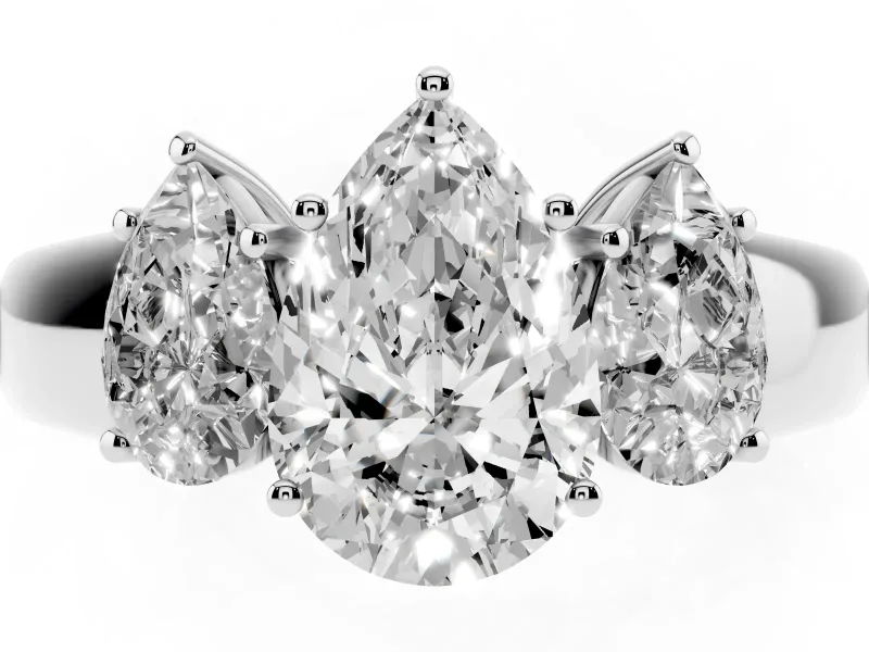 Three-Stone Pear Cut Diamond Ring Set in Platinum with Matching Prong Settings and Plain Band
