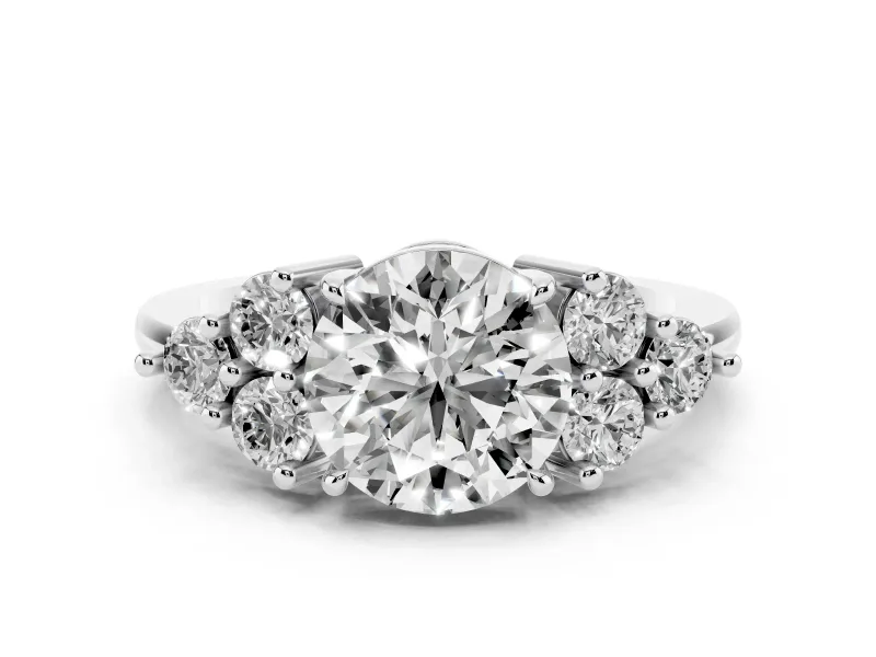 Round Cut Diamond Solitaire Ring Set in White gold with Cluster Accents on Each Side
