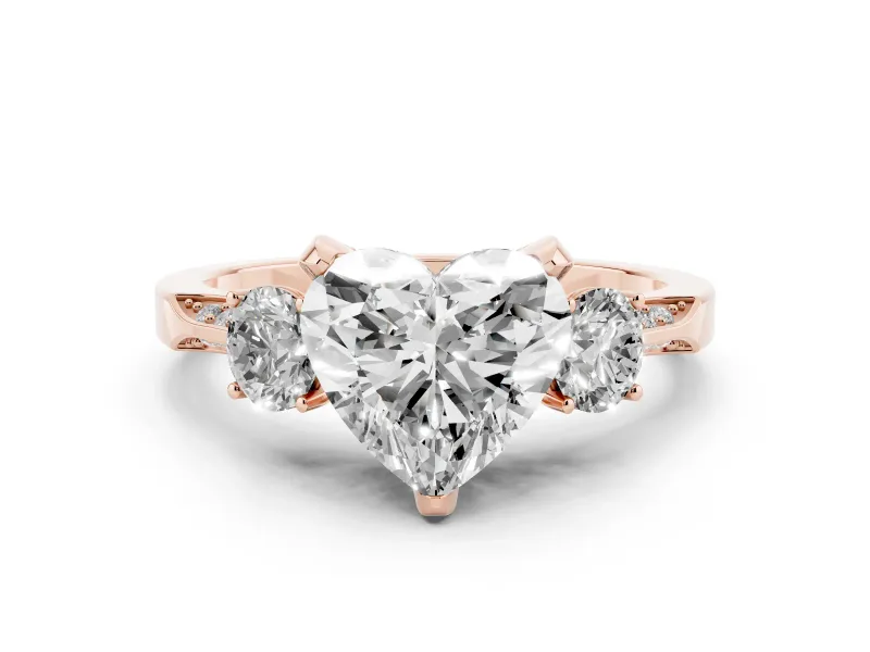 Heart Cut Diamond Three-Stone Ring Set in Rose gold with Pavé Band and Smaller Side Stones