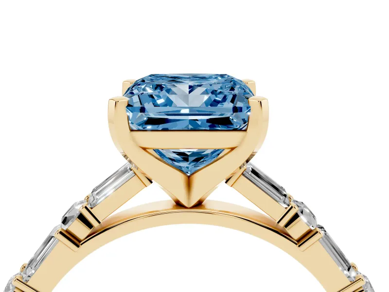 Fancy Blue Princess Cut Diamond Solitaire Set in Yellow gold with Side Baguettes and Channel Set Band