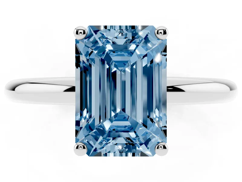 Fancy Blue Emerald Cut Diamond Solitaire Engagement Ring Set in Silver with Prong Setting and Polished Band