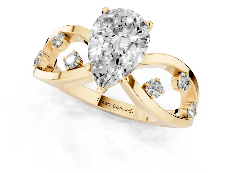 Pear Cut Diamond Solitaire Ring Set in Yellow gold with Side Stones on Criss-Cross Band and Prong Setting