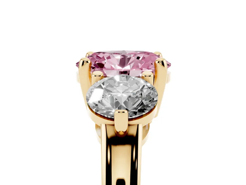 Fancy Pink Oval Cut Diamond Three-Stone Ring Set in Yellow gold with Prong Setting and Classic Band