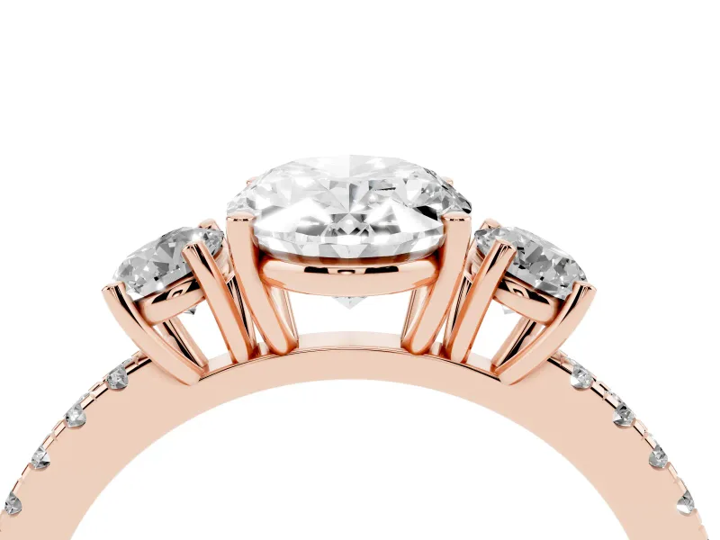 Oval Cut Diamond Three-Stone Ring Set in Rose gold with Pavé Band and Graduated Sides