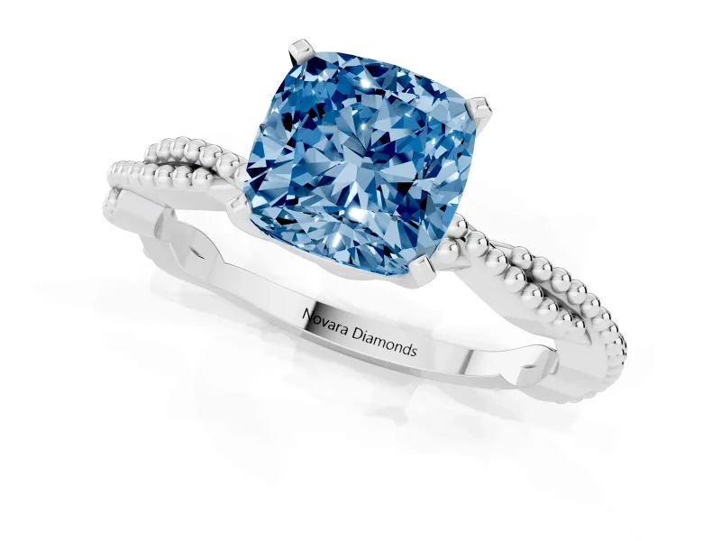 Fancy Blue Cushion Cut Diamond Solitaire Ring Set in Platinum with Twisted Band and Bead Prong Setting