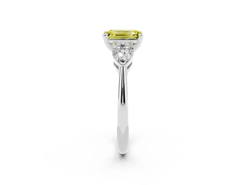 Fancy Yellow Three-Stone Emerald Cut Diamond Ring Set in Platinum with Pear Side Stones and Prong Setting