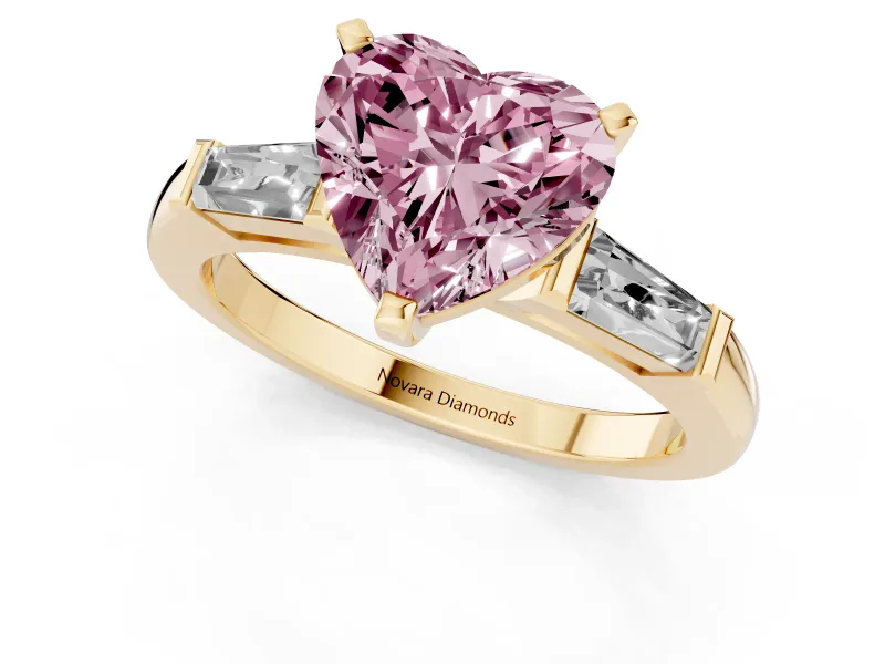 Fancy Pink Heart Cut Diamond Solitaire Ring Set in Yellow gold with Tapered Baguette Side Stones and Prong Setting