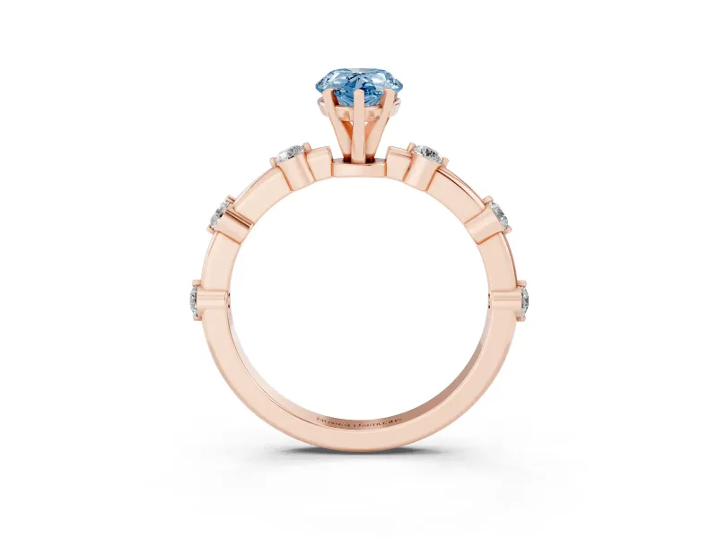 Fancy Blue Pear Cut Diamond Solitaire Ring Set in Rose gold with Bezel Set Side Stones and Prong Setting