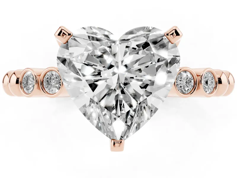 Heart Cut Diamond Solitaire Engagement Ring Set in Rose gold with Bezel Accents on Beaded Band