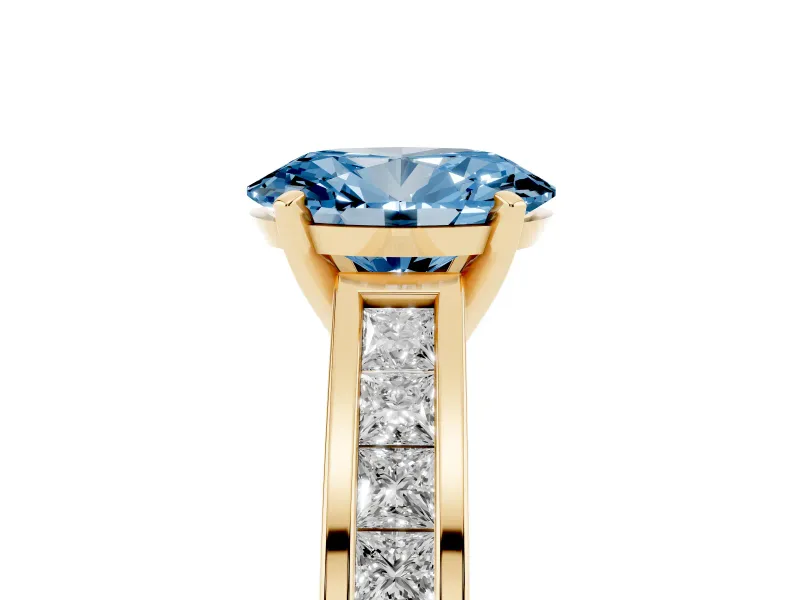 Fancy Blue Oval Cut Diamond Solitaire Ring Set in Yellow gold with Channel-Set Band and Prong Setting