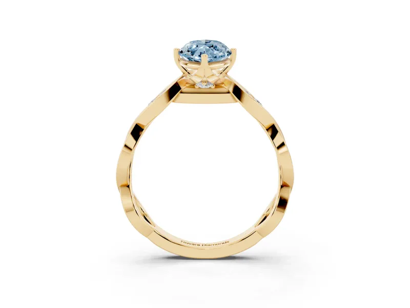 Fancy Blue Marquise Cut Diamond Twist Band Solitaire Ring Set in Yellow gold with Leaf Prong Setting and Accent Stones