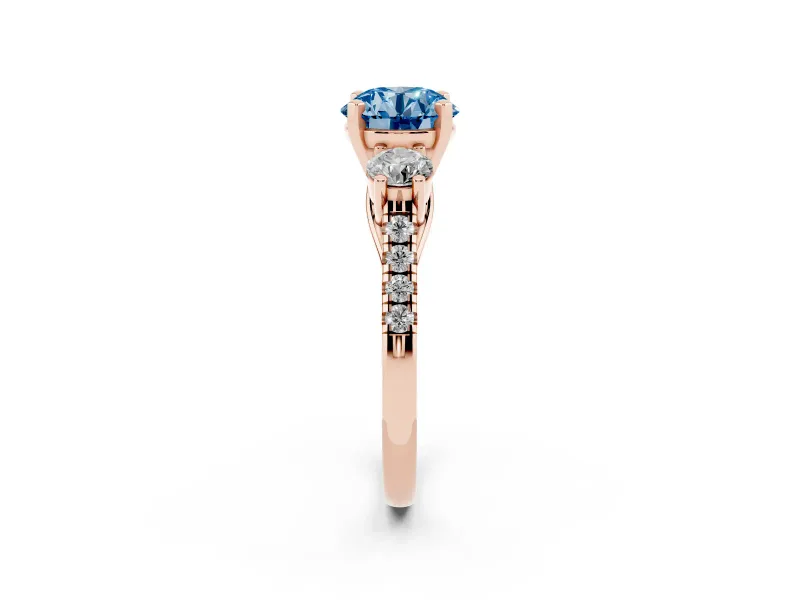 Fancy Blue Three-Stone Round Cut Diamond Pavé Band Ring Set in Rose gold with Prong-Set Trio