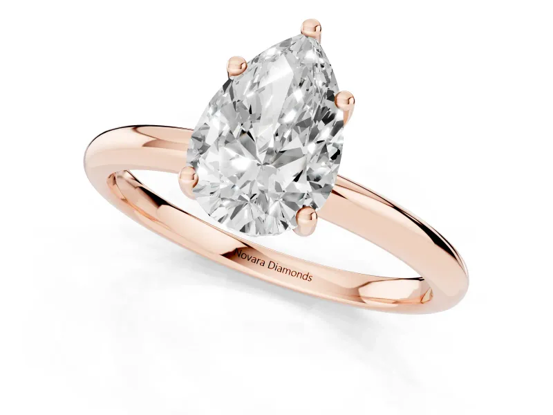 Pear Cut Diamond Solitaire Engagement Ring Set in Rose gold with Prong Setting and Polished Band