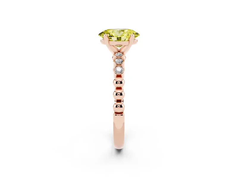 Fancy Yellow Oval Cut Diamond Solitaire Engagement Ring Set in Rose gold with Bezel Accents on Beaded Band