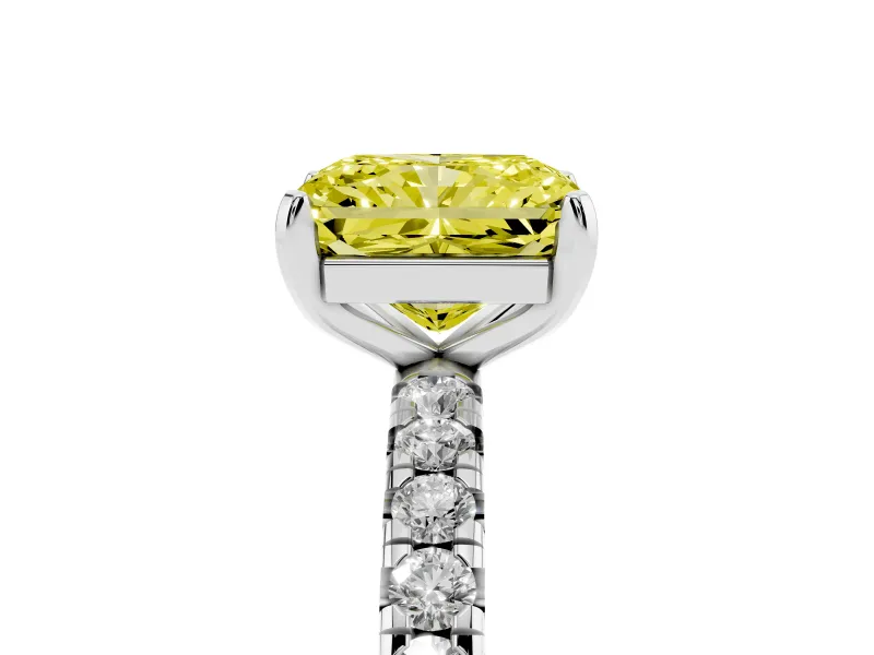 Fancy Yellow Radiant Cut Diamond Pavé Solitaire Ring Set in White gold with Round Band and Prong Setting