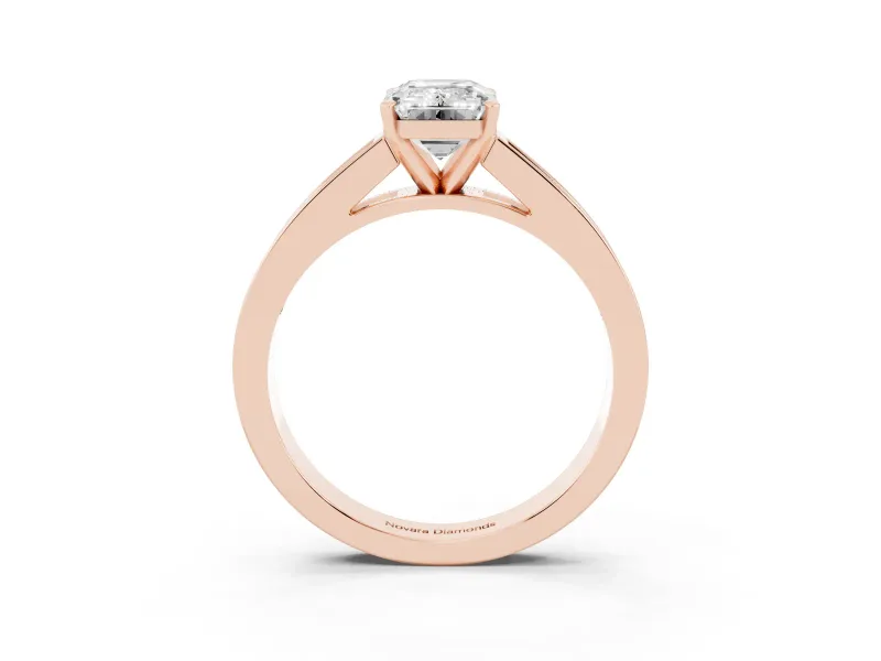 Emerald Cut Diamond Solitaire Ring Set in Rose gold with Channel-Set Band and Prong Setting