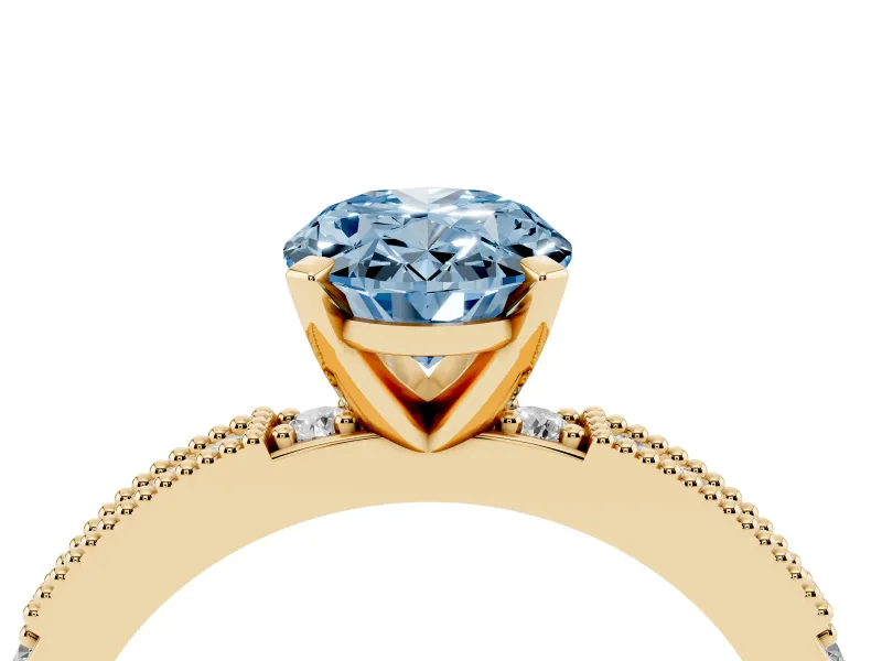 Fancy Blue Oval Cut Diamond Solitaire Ring Set in Yellow gold with Slim Pavé Band and Prong Setting